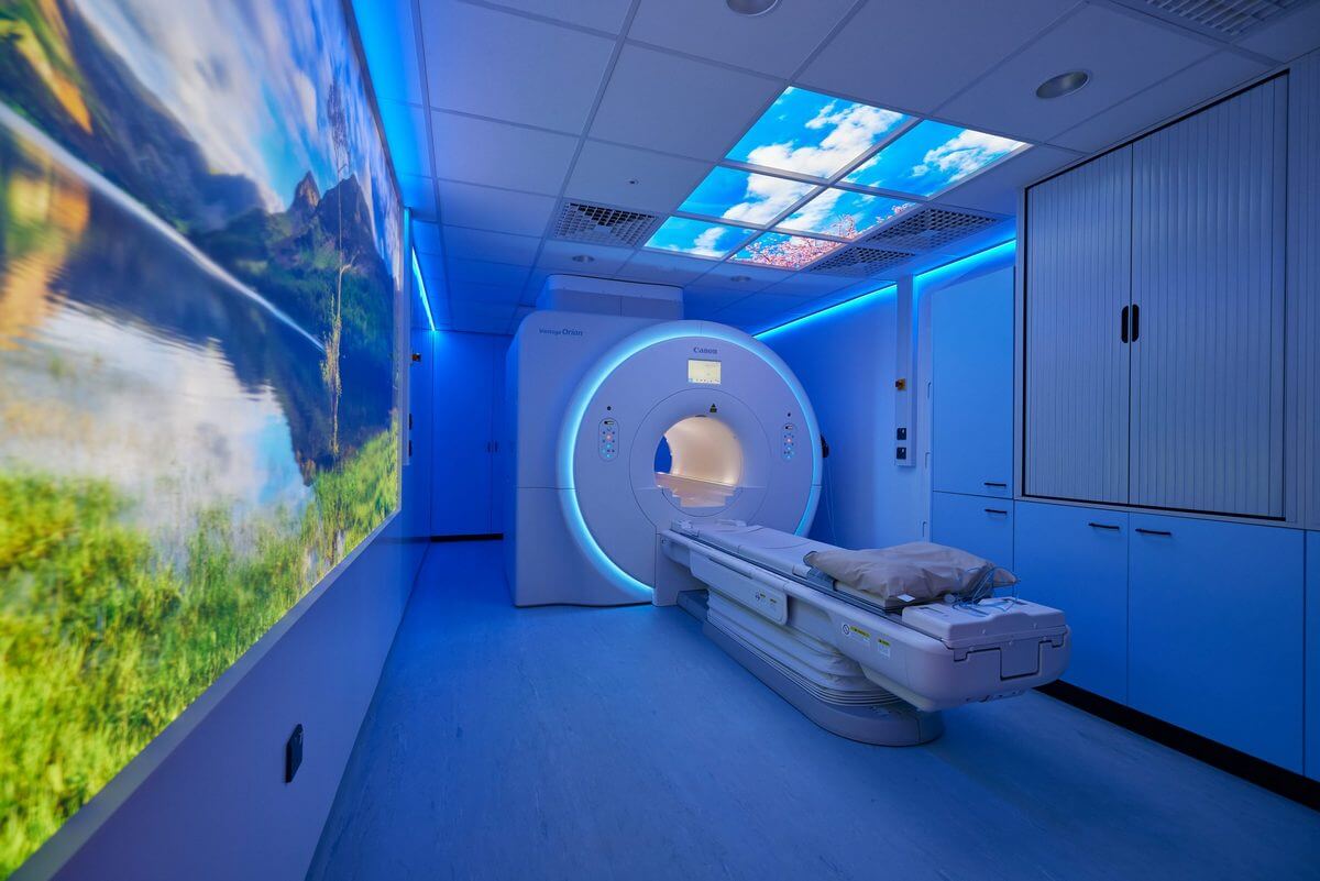 Modern MRI scanner installed in a compliant shielded room meeting regulatory standards