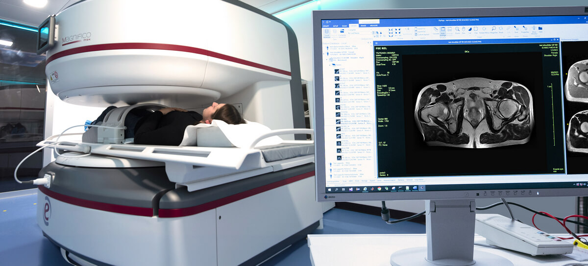 Interventional MRI suite with specialized open-bore scanner and surgical access configuration