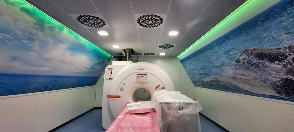 Modular MRI Faraday cage panels being assembled on site during shielded room construction