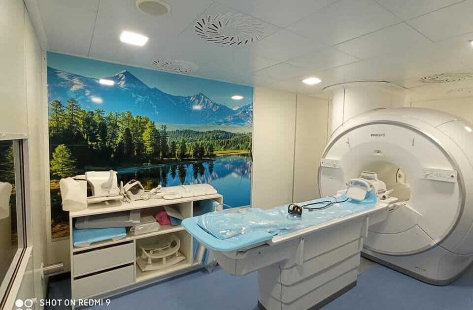 MRI room penetration panel with filtered connectors and waveguide entries mounted on the Faraday cage wall